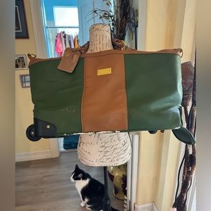JM NY beautiful real leather bag traveling with pull out handle and wheels!